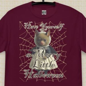 Image of the t-shirt design featuring a cute little bat girl dressed in a victorian dress against a spider web background, overlaid is the text "Have yourself a merry little halloween"